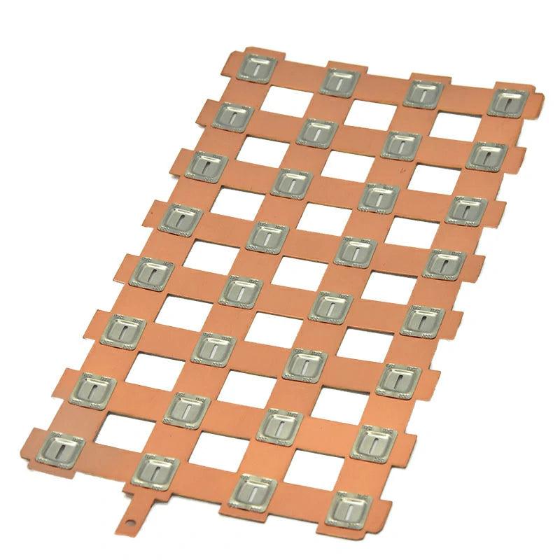 Grid-pattern laminated copper busbar sheet with precision-punched tabs for battery module integration and improved current distribution